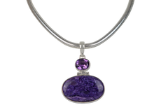 Very beautiful purple colour Oval cut Chorite pendant sitting horizontally with a very beautiful faceted Amethyst