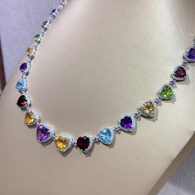 Natural Heart Shaped Tennis Necklace with Semi - Precious Gemstones & CZ - Elegant Jewelry for Women - Amethyst, Citrine, Red Garnet, Blue Topaz, Olivine, White and Purple CZ in Prong and Halo Setting on 925 Silver (33 Stones, 53 ct) with multi dimensions - Necklace - British D'sire