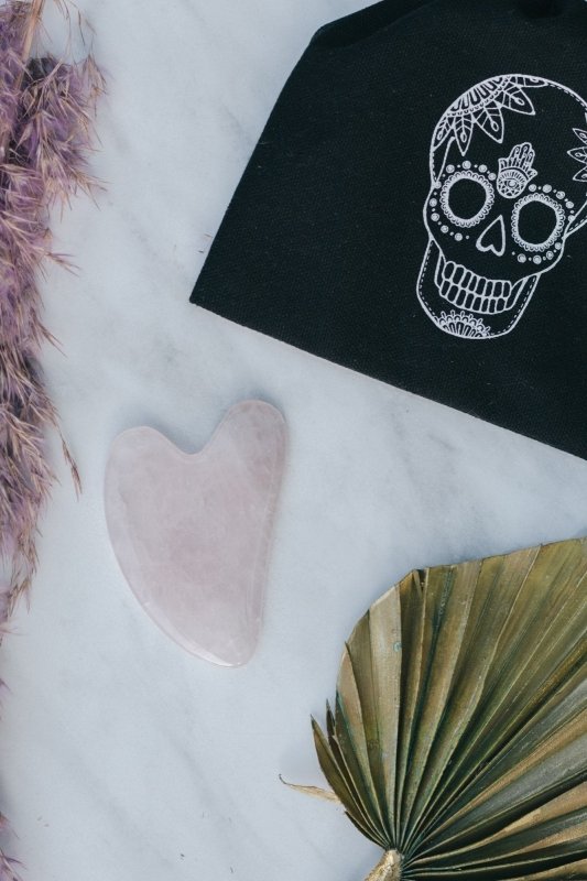 Rose Quartz Crystal Gua Sha with Black Skull Pouch - Cosmetic Tools - British D'sire